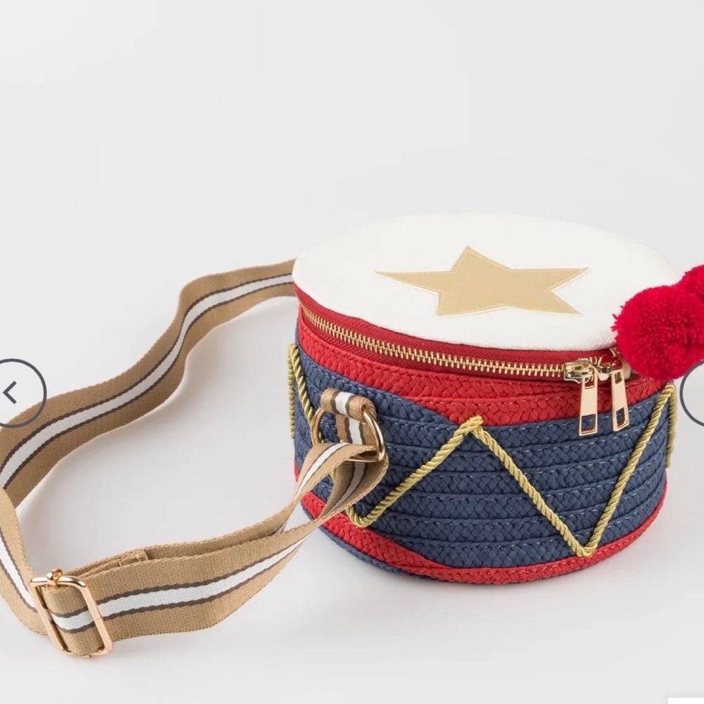 Drum Crossbody Bag. This unique woven drum-shaped purse features a gold star